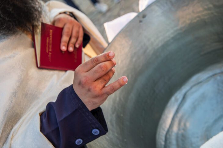 Priest blessing the water in Kolymbithra